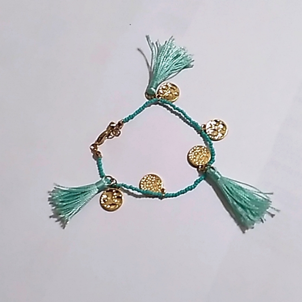 Teal and gold colored bracelet